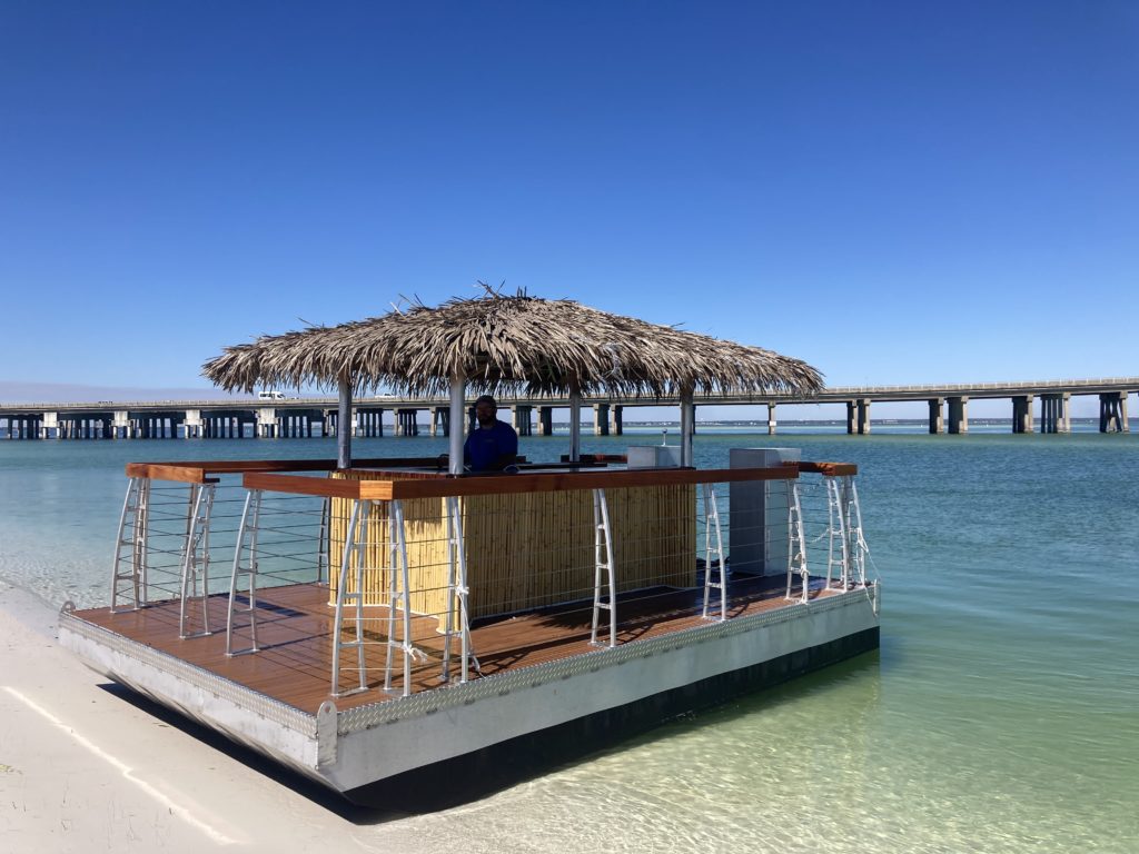 destin tiki rental boat beached on shore